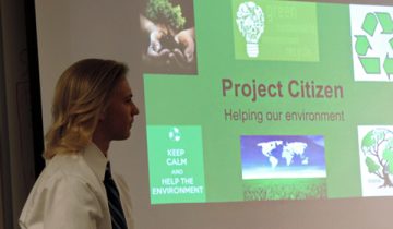 man giving presentation of project citizen helping our environment