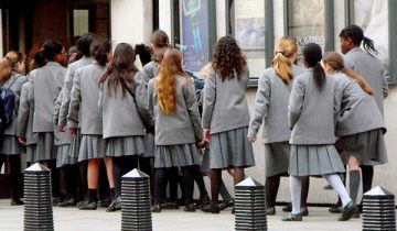 Group of London-based students in school uniform