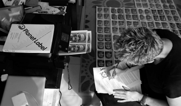 Woman printing photos for ebola health worker suits