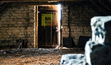 modified “Attic Door” photo with a custom logo superimposed on the door by Alan Levine