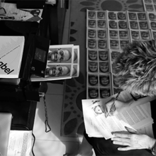 Woman printing photos for ebola health worker suits