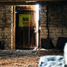 modified “Attic Door” photo with a custom logo superimposed on the door by Alan Levine